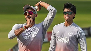 | Photo: PTI/Shailendra Bhojak : India’s Axar Patel, left, and Abhishek Sharma during a practice session on the eve of the first T20 cricket match of a series between India and South Africa, at Barabati Stadium, in Cuttack, Odisha.