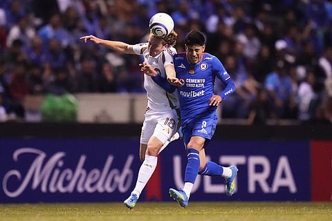 Jacob Shaffelburg of the United States' Los Angeles FC, left, and Omar Campos of Mexico's Cruz Azul battle for the ball during a CONCACAF Champions Cup quarterfinal second leg soccer match in Puebla, Mexico.
