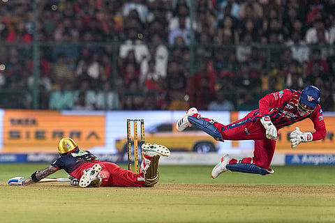Bengaluru: Royal Challengers Bengaluru's Virat Kohli, left, defends a runout during the Indian Premier League (IPL) 2026 T20 cricket match between Royal Challengers Bengaluru and Lucknow Super Giants, at M Chinnaswamy Stadium in Bengaluru, Karnataka.