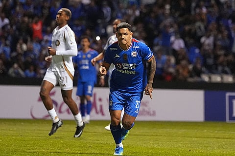 Gabriel Fernandez of Mexico's Cruz Azul celebrates scoring his side's opening goal from the penalty spot against the United States' Los Angeles FC during a CONCACAF Champions Cup quarterfinal second leg soccer match in Puebla, Mexico.