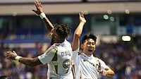 (AP Photo/Eduardo Verdugo) : Son Heung-Min, right, congrats Denis Bouanga of the United States' Los Angeles FC after scoring his side's first goal against Mexico's Cruz Azul during a CONCACAF Champions Cup quarterfinal second leg soccer match in Puebla, Mexico, Tuesday, April 14, 2026