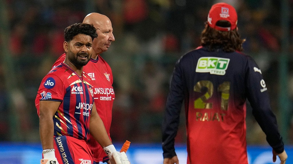 Lucknow Super Giants' captain Rishabh Pant, left, leaves the field after being retired hurt during the Indian Premier League match against Royal Challengers Bengaluru in Bengaluru. - AP/Aijaz Rahi