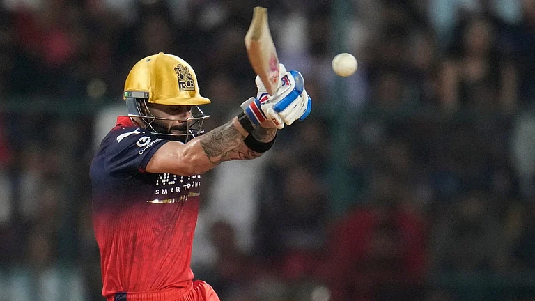 Royal Challengers Bengaluru's Virat Kohli plays a shot during their Indian Premier League match against Lucknow Super Giants in Bengaluru. - AP/Aijaz Rahi