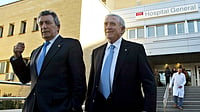 (AP Photo/Fernando Bustamante, File) : FILE -Former Real Madrid soccer players Enrique Perez "Pachin", left, and Jose Emilio Santamaria leave La Fe hospital in Valencia, Spain, Dec. 27, 2005 after visiting their former teammate Alfredo di Stefano, of Argentina. 