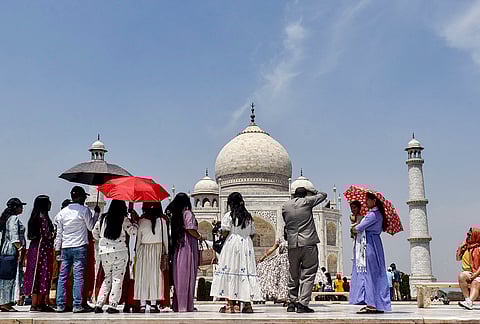 Tourists visit Taj Mahal on a hot summer day, in Agra, Uttar Pradesh.