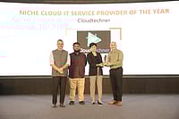 Siba Prasad Pulugurty receiving the Niche Cloud IT Service Provider of the Year at the Outlook Business Spotlight Leadership & Enterprise Awards