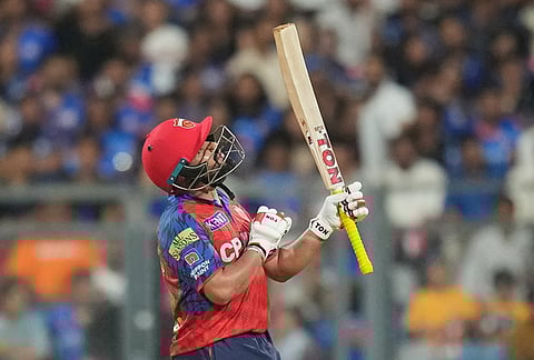 Punjab Kings' wicketkeeper Prabhsimran Singh celebrates his fifty runs during the Indian Premier League cricket match between Mumbai Indians and Punjab Kings in Mumbai.