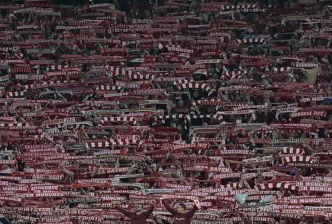 Bayern's supporters cheer during the Champions League quarterfinal second leg soccer match between Bayern Munich and Real Madrid in Munich, Germany.