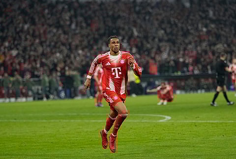 Bayern's Michael Olise celebrates after scoring his side's fourth goal uring the Champions League quarterfinal second leg soccer match between Bayern Munich and Real Madrid in Munich, Germany.