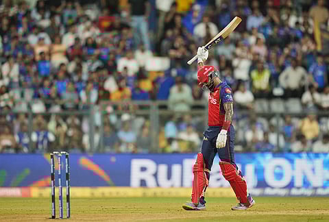 Punjab Kings' captain Shreyas Iyer celebrates his fifty runs during the Indian Premier League cricket match between Mumbai Indians and Punjab Kings in Mumbai.