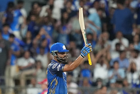 Mumbai Indians' Naman Dhir celebrates his fifty runs during the Indian Premier League cricket match between Mumbai Indians and Punjab Kings in Mumbai.