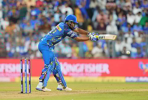 Mumbai Indians' Naman Dhir plays a shot during the Indian Premier League cricket match between Mumbai Indians and Punjab Kings in Mumbai.