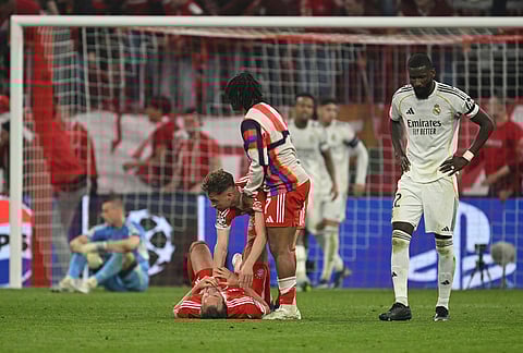 Bayern Munich players celebrate at the end of the Champions League quarterfinal second leg soccer match between Bayern Munich and Real Madrid in Munich, Germany.