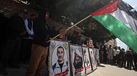 Photo: IMAGO / NurPhoto : Protest In Gaza As Israel Approves Death Penalty For Palestinians Convicted Of Murder Protesters hold placards outside the Red Cross offices in Gaza City, on March 31, 2026, during a rally against a bill approved by Israel s parliament that would allow the execution of Palestinians convicted on charges related to deadly attacks. Israel s parliament approved the bill on March 30, 2026, which has faced criticism and a court challenge.