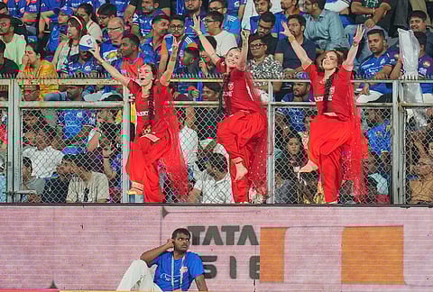 Cheer girls dance during the Indian Premier League cricket match between Mumbai Indians and Punjab Kings in Mumbai.
