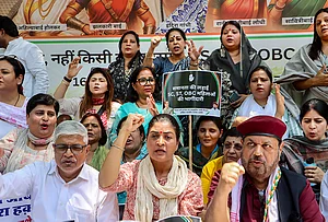 | Photo: PTI : Congress leader Alka Lamba, front centre, and others stage a protest demanding SC/ST reservation in the 'Nari Shakti Vandan Adhiniyam', commonly known as the Women's Reservation Act, in New Delhi. A special three-day sitting of Parliament is being held from April 16 to 18, during which amendments to the Act, mandating 33 per cent reservation for women in Lok Sabha and state Assemblies, will be brought for implementation in 2029.