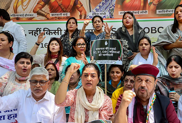 Congress leader Alka Lamba, front centre, and others stage a protest demanding SC/ST reservation in the 'Nari Shakti Vandan Adhiniyam', commonly known as the Women's Reservation Act, in New Delhi. A special three-day sitting of Parliament is being held from April 16 to 18, during which amendments to the Act, mandating 33 per cent reservation for women in Lok Sabha and state Assemblies, will be brought for implementation in 2029. - | Photo: PTI