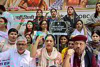 131st Amendment Bill On Women’s Reservation Defeated In Lok Sabha | Photo: PTI : Congress leader Alka Lamba, front centre, and others stage a protest demanding SC/ST reservation in the 'Nari Shakti Vandan Adhiniyam', commonly known as the Women's Reservation Act, in New Delhi. A special three-day sitting of Parliament is being held from April 16 to 18, during which amendments to the Act, mandating 33 per cent reservation for women in Lok Sabha and state Assemblies, will be brought for implementation in 2029.