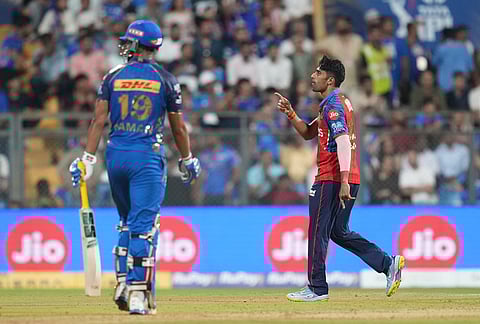 Punjab Kings' Shashank Singh celebrates the wicket of Mumbai Indians' Naman Dhir during the Indian Premier League cricket match between Mumbai Indians and Punjab Kings in Mumbai.