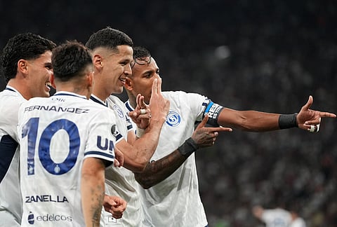 Alex Arce of Argentina's Independiente Rivadavia, second from right, celebrates with teammates after scoring his side's second goal against Brazil's Fluminense during a Copa Libertadores Group C soccer match in Rio de Janeiro.
