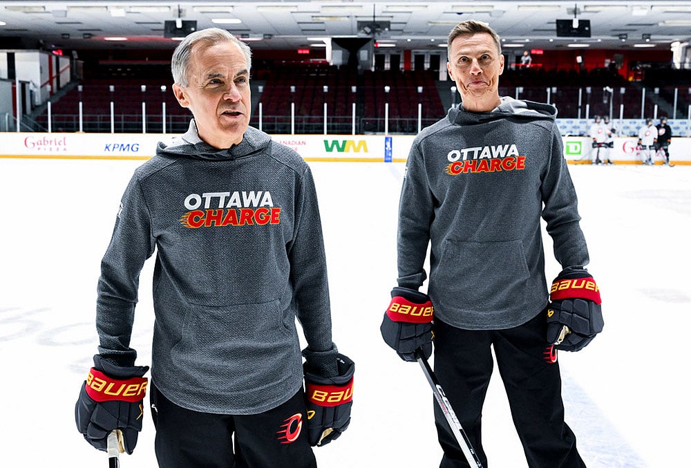 Canada Prime Minister Mark Carney, left, and President of Finland Alexander Stubb speak to reporters as they participate in an Ottawa Charge hockey practice session at TD Place in Ottawa.  - | Photo: Spencer Colby/The Canadian Press via AP