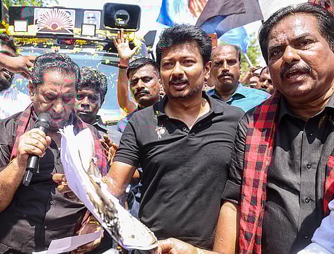 Tamil Nadu Deputy Chief Minister and DMK Youth Wing Secretary Udhayanidhi Stalin, centre, along with party workers burn copies of the proposed Delimitation bill during a protest, at the party office, in Madurai.