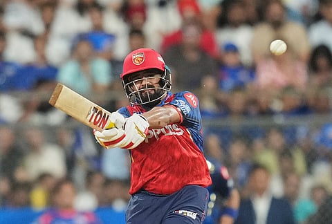 Punjab Kings' wicketkeeper Prabhsimran Singh plays a shot during the Indian Premier League cricket match between Mumbai Indians and Punjab Kings in Mumbai.