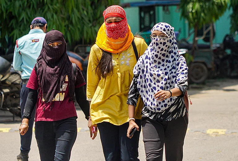 Women cover themselves amid heat on a hot summer day, in Varanasi, Uttar Pradesh. - | Photo: PTI