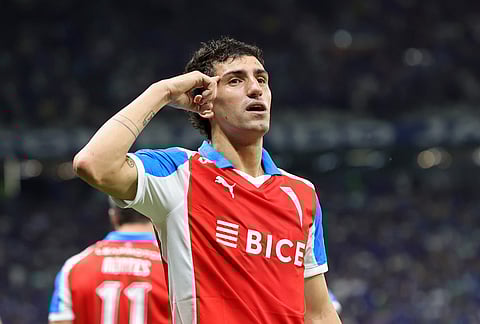Justo Giani of Chile's Universidad Catolica celebrates after scoring his side's opening goal against Brazil's Cruzeiro during a Copa Libertadores group D soccer match in Belo Horizonte, Brazil.