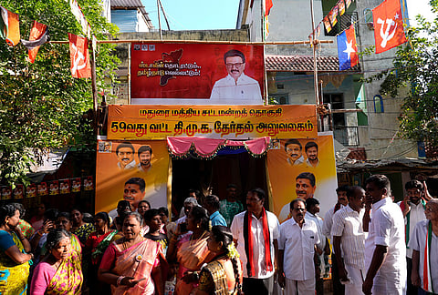 People gather outside the DMK election party office in Madurai during Tamil Nadu Assembly Election 2026. 