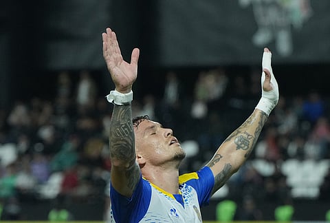 Enzo Copetti of Argentina's Rosario Central celebrates scoring his side's opening goal against Paraguay's Libertad during a Copa Libertadores Group H soccer match in Asuncion, Paraguay.