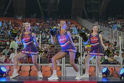 Cheer girls dance during the Indian Premier League cricket match between Gujarat Titans and Kolkata Knight Riders in Ahmedabad.