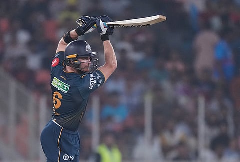 Gujarat Titans' Glenn Phillips hits a boundary during the Indian Premier League cricket match between Gujarat Titans and Kolkata Knight Riders in Ahmedabad.