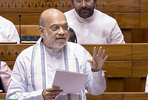 Union Home Minister Amit Shah speaks in the Lok Sabha during the Special session of Parliament, in New Delhi.
