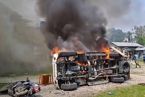 Protestors set a vehicle ablaze following the detention of a few locals over alleged encroachment of reserved forest land, at Runikhata range office, in Chirang district, Assam. The mob ransacked the forest range office and torched government vehicles inside the premises, located close to the Bhutan border, officials said. 