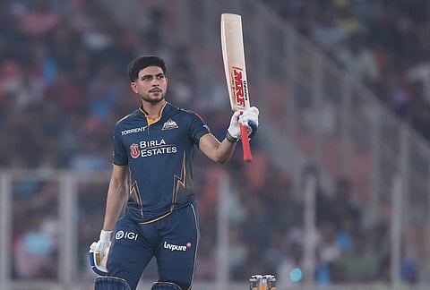 Gujarat Titans' captain Shubman Gill celebrates his fifty runs during the Indian Premier League cricket match between Gujarat Titans and Kolkata Knight Riders in Ahmedabad.