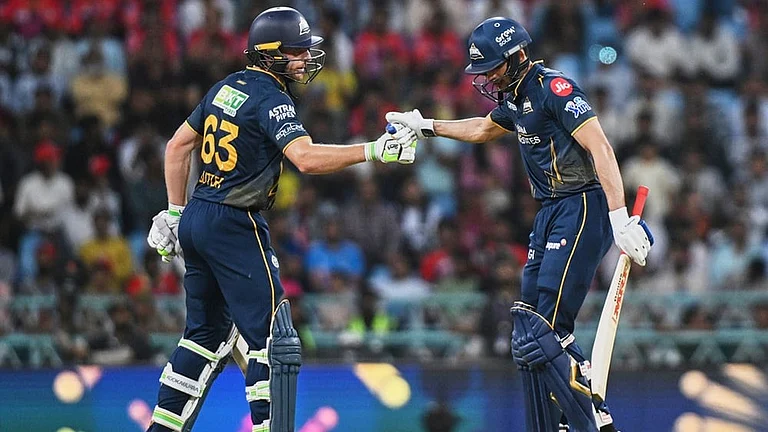 Gujarat Titans' Jos Buttler congratulates captain Shubman Gill after his fifty runs during the Indian Premier League cricket match between Gujarat Titans and Lucknow Super Giants in Lucknow, India. - | Photo: AP/STR