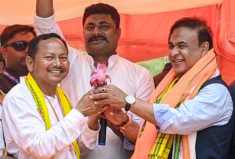 Assam Chief Minister Himanta Biswa Sarma, right, during an election campaign in support of BJP candidates ahead of the West Bengal Assembly Election, at Raiganj, in Uttar Dinajpur district.
