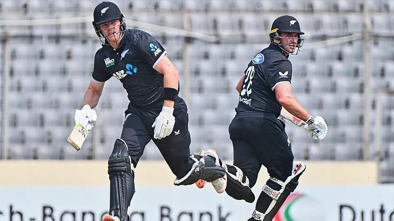 New Zealand's Dean Foxcroft, left, and Josh Clarkson run between the wickets to score during the first one day international cricket match between Bangladesh and New Zealand in Mirpur, Bangladesh. - AP Photo