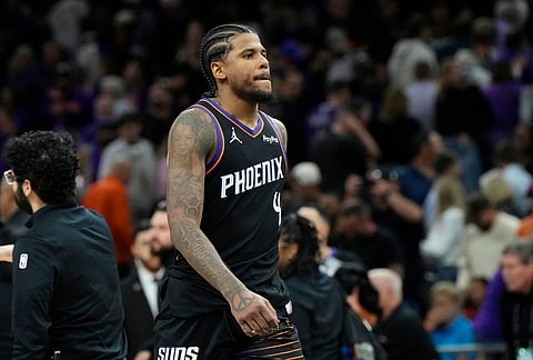 Phoenix Suns guard Jalen Green walks off the court after the Suns loss to the Portland Trail Blazers after an NBA play-in tournament basketball game, in Phoenix. 