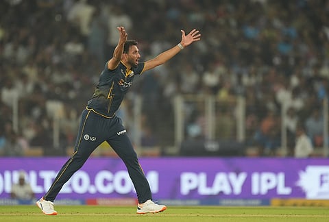 Gujarat Titans' Prasidh Krishna appeals unsuccessfully for the wicket of Kolkata Knight Riders' Rovman Powell during the Indian Premier League cricket match between Gujarat Titans and Kolkata Knight Riders in Ahmedabad.