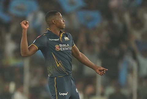 Gujarat Titans' Kagiso Rabada celebrates the wicket of Kolkata Knight Riders' Tim Seifert during the Indian Premier League cricket match between Gujarat Titans and Kolkata Knight Riders in Ahmedabad.