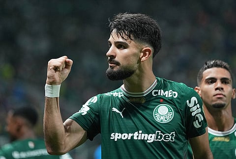 Flaco Lopez of Brazil's Palmeiras celebrates after scoring from the penalty spot his side's 2nd goal against Peru's Sporting Cristal during a Copa Libertadores Group F soccer match in Sao Paulo.