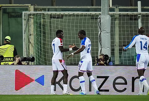 Crystal Palace's Ismaila Sarr, left, celebrates scoring during the Conference League quarterfinal 2nd leg soccer match between Fiorentina and Crystal Palace in Florence, Italy.