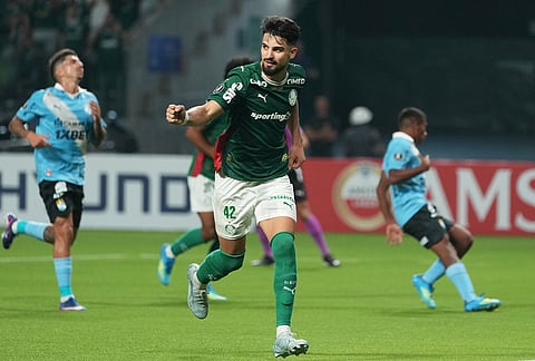 Flaco Lopez of Brazil's Palmeiras celebrates after scoring from the penalty spot his side's 2nd goal against Peru's Sporting Cristal during a Copa Libertadores Group F soccer match in Sao Paulo.