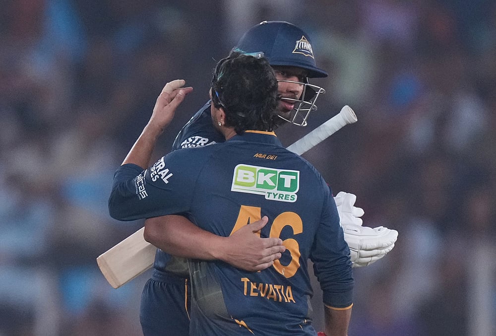 Gujarat Titans' Shahrukh Khan and Rahul Tewatia celebrate the win over Kolkata Knight Riders during the Indian Premier League cricket match in Ahmedabad. - | Photo: AP/Ajit Solanki