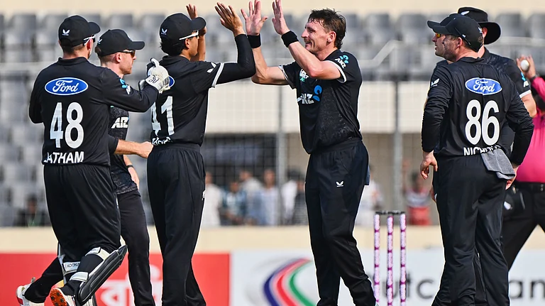 New Zealand's Nathan Smith, celebrates with teammates the wicket of Bangladesh's Tanzid Hasan during the first one day international cricket match between Bangladesh and New Zealand. - AP Photo