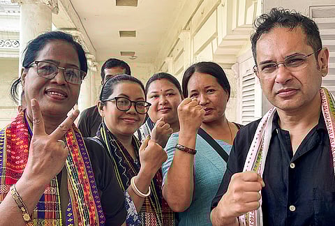 Tipra Motha Party founder Pradyot Bikram Manikya Deb Barma, right, along with supporters celebrates after winning 24 out of 28 seats in the Tripura Tiprasa Areas Autonomous District Council (TTAADC) elections, in Tripura, Agartala.