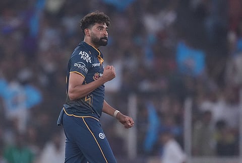 Gujarat Titans' Mohammed Siraj celebrates the wicket of Kolkata Knight Riders' Sunil Narine during the Indian Premier League cricket match between Gujarat Titans and Kolkata Knight Riders in Ahmedabad.