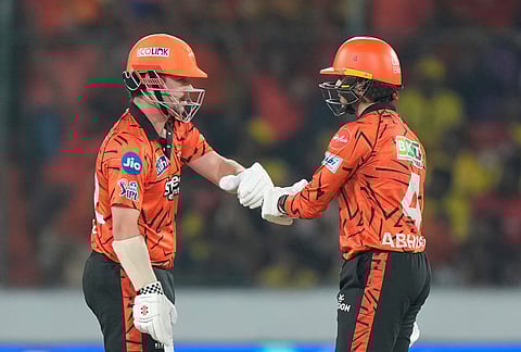 Sunrisers Hyderabad's Travis Head, left, and Abhishek Sharma greets each other during the Indian Premier League cricket match between Sunrisers Hyderabad and Chennai Super Kings in Hyderabad.
